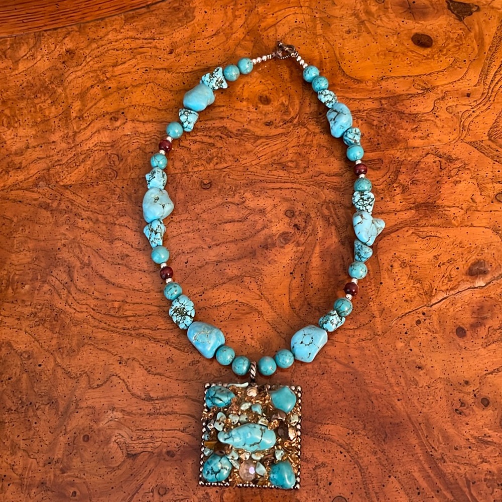 Costume turquoise and silver necklace. 12” drop from clasp to bottom of square.